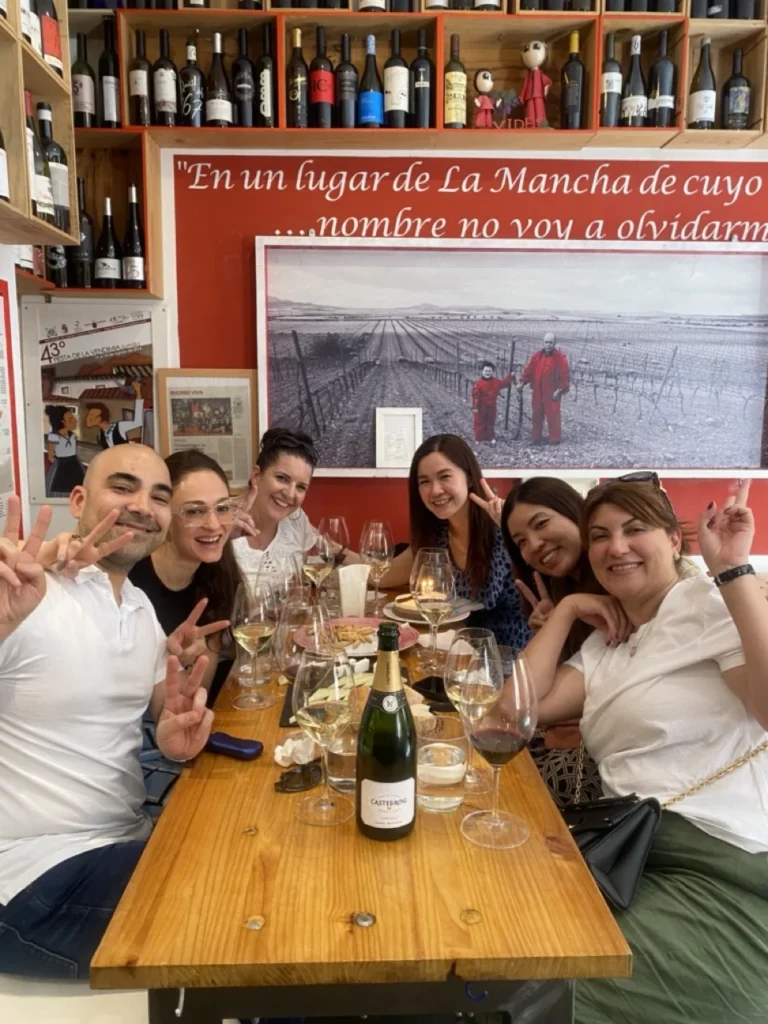 wine and tapas- friend group having fun-colorful wines