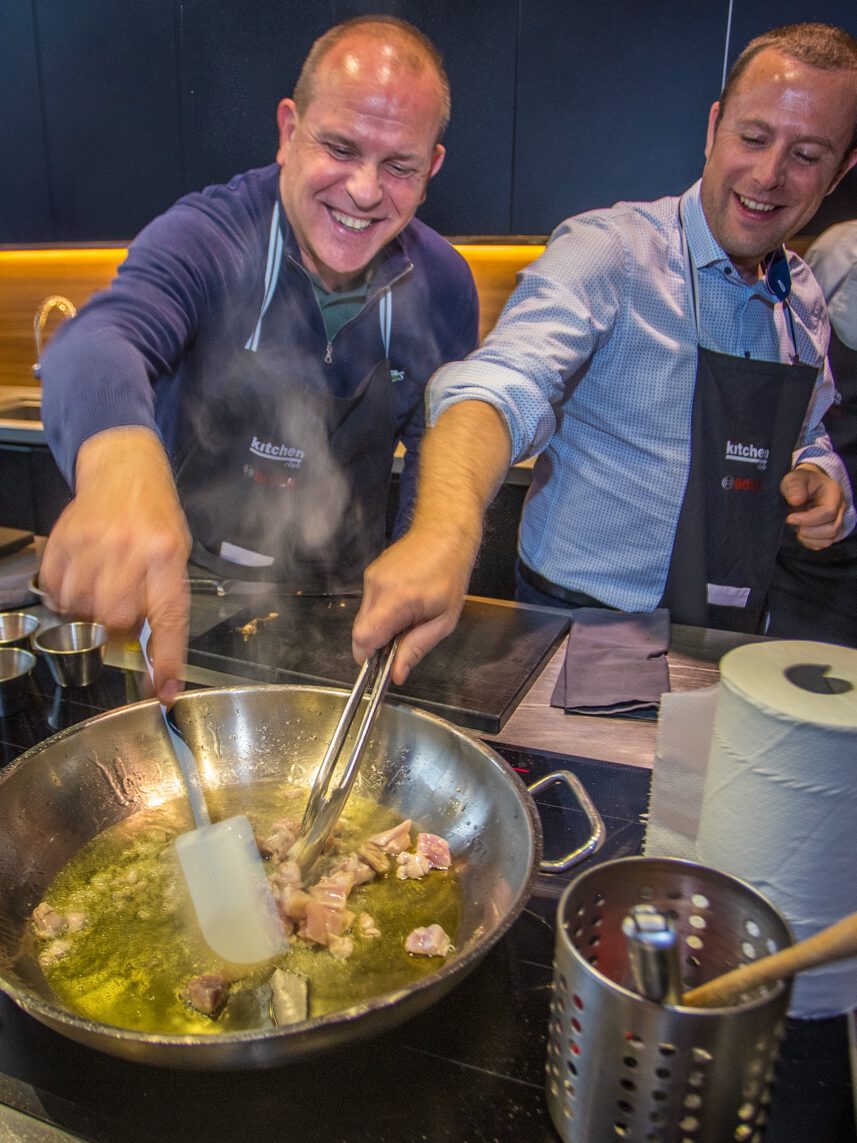 cooking paella experience in Madrid colorful wines